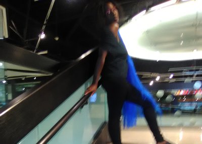 Shawntae Green with Long Blue Hair and a big Black Bun