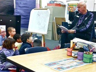 RICH READING "HIPPO D. HOP' TO THE STUDENTS IN LA ELEMENTARY SCHOOL......