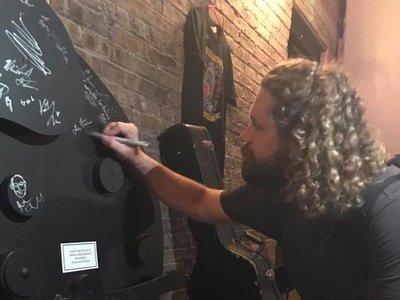 Signing the big guitar after an awesome set at 'The Venue' in Aurora, IL 09/19/2019