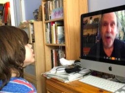 grandson listening to me sing Welcome Up songs at virtual Internet Heliosphere concert April 2020