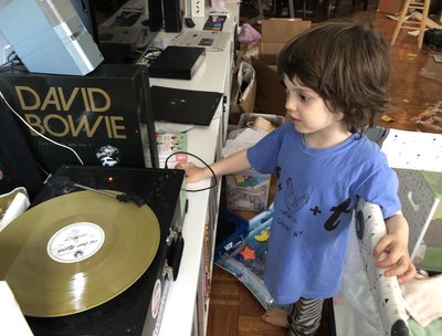 grandson enjoying Welcome Up: Space and Time vinyl on Light in the Attic Records