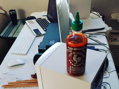 Quarantined home office set-up doing music production with one of my favorite hot sauces. #HOT