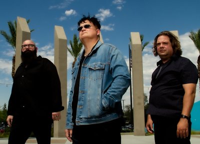L to R: Tony Jordan (Bass, Backup Vocals), thurane (Lead Vocals, Guitar) & Andy Augustin (Drums)