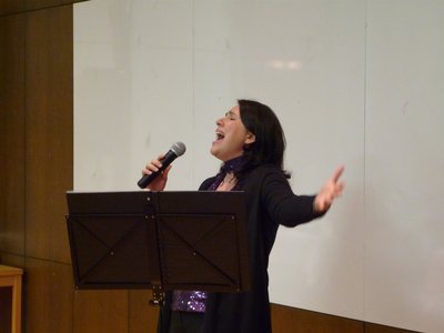 Singing Oh holy night at a christmas office party