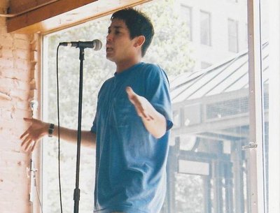 Performing at the Southern Fried Poetry Slam in Memphis, TN in the summer of 2002