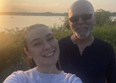 My sweet daughter and me on a neighborhood walk in late August '25