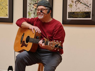 Paul performing "A Root Awakening" at Sue Edwards opening, Pepperell Library