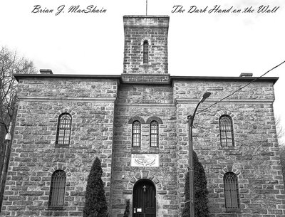 The Dark Hand on the Wall
