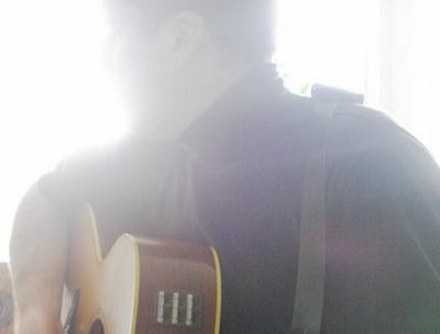 The Takamine EN-20 was a really good guitar. Just a photo of me looking out a window, fun.