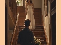 lady at top of stairs