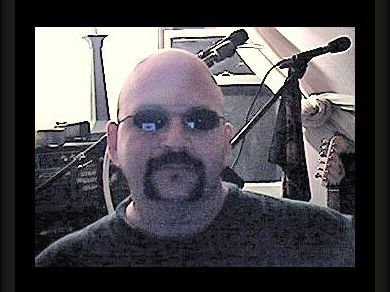 Sitting at my desk in my home studio 2005