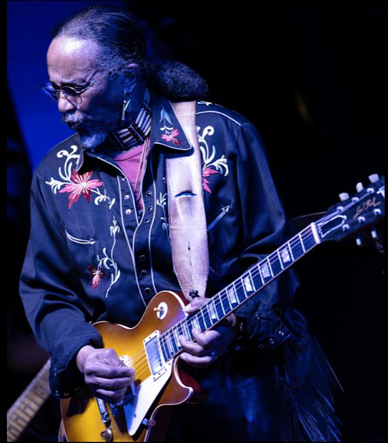 Bobby Young performing live on guitar