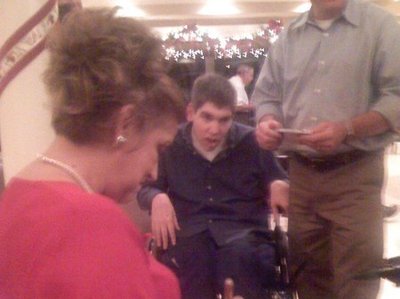 Judith signs autograph for Make-A -Wish