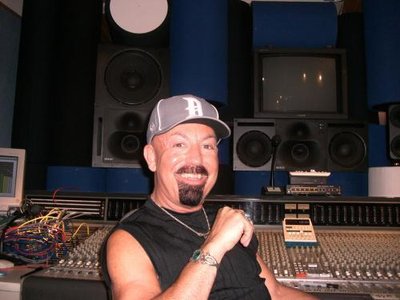 DICARLO working behind the desk at his OMM studio