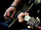 Travis playing guitar