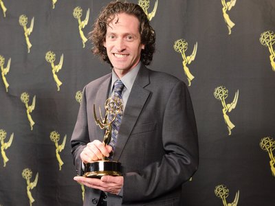 picture of BZ winning an Emmy 2011