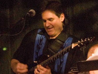 Michael Lewis on guitar and vocals for the SJO