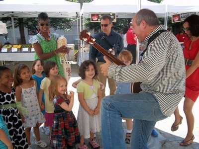 Entertaining children at Capital Harvest on the Plaza, Washington, DC, 2010.