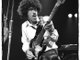 Phil Lynott Playing His Bass with Thin Lizzy