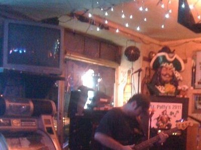Kent Householder slaping a misbehaving bass guitar...