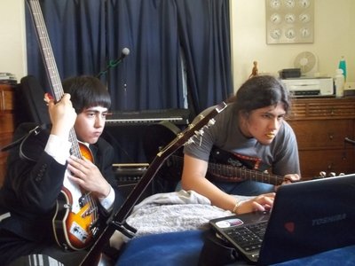 Alec & Marcos looking up tabs during the early years of The Anglomaniacs.