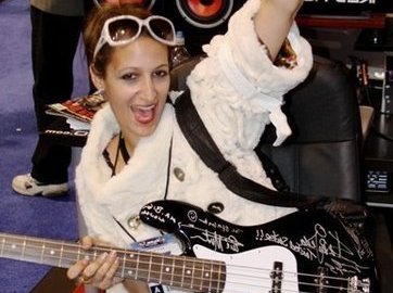 ROCK ON Holding a bass gifted to me at the NAMM SHOW signed by twisted sister and tina marie and a f