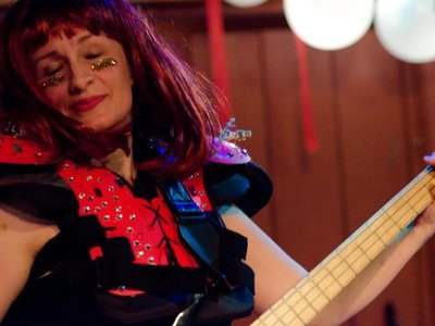 Nancy loves her bass. Photo by Renee L'Abbe.