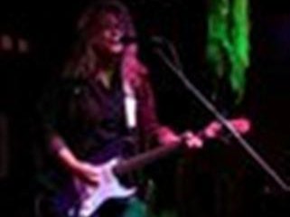Linda at a blues jam in Murfreesboro, TN ... trying my hand at electric blues guitar ...not so easy!