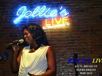 Jackie singing at the Grand Opening of Jollie's Live with Richard Tucker and The Universal Koncept